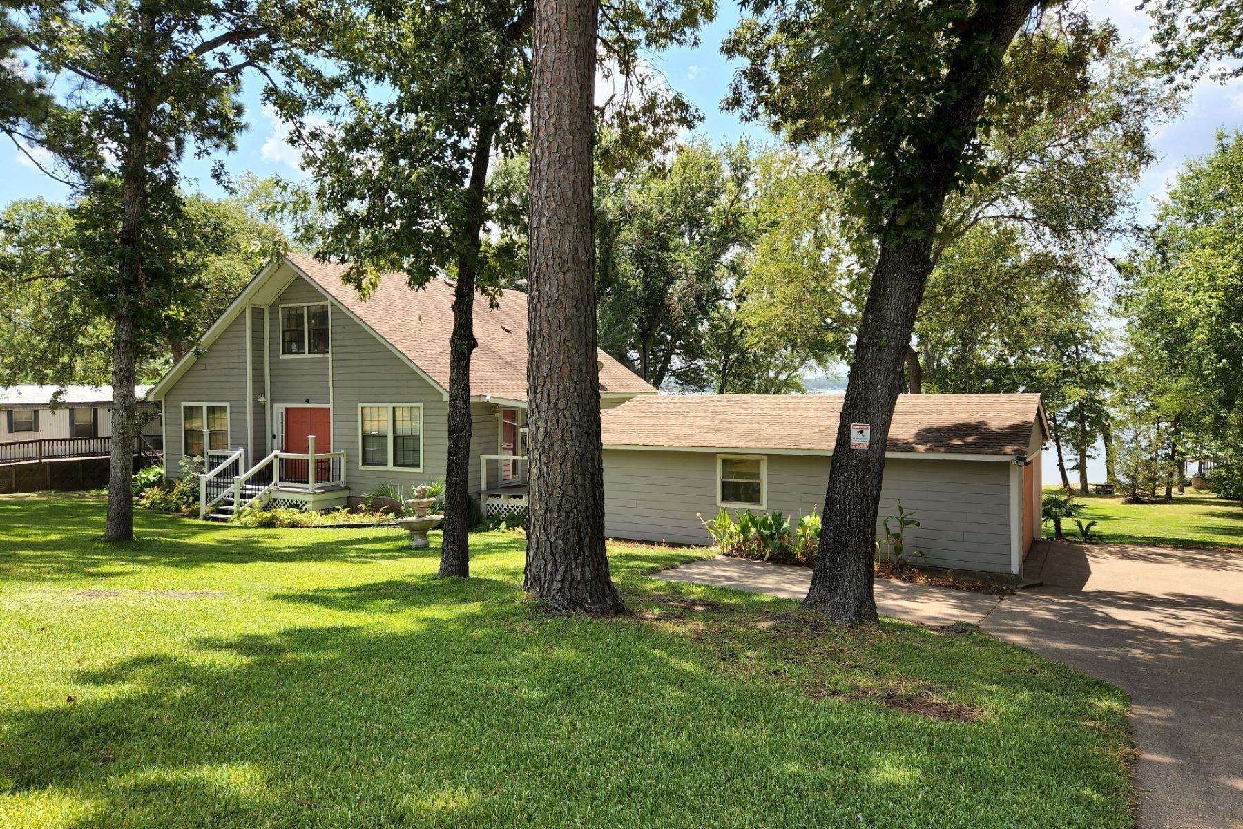 Single Family Homes for Sale at Picturesque Waterfront Home on Lake Palestine 22480 Shady Trail Flint, Texas 75762 United States